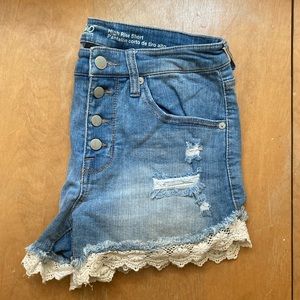 High-rise distressed denim shorts with white trim